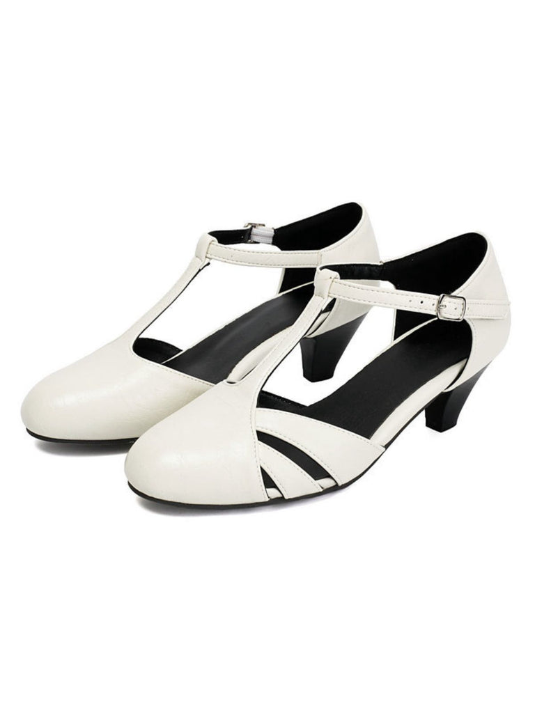 White shoes with black accents on a white background