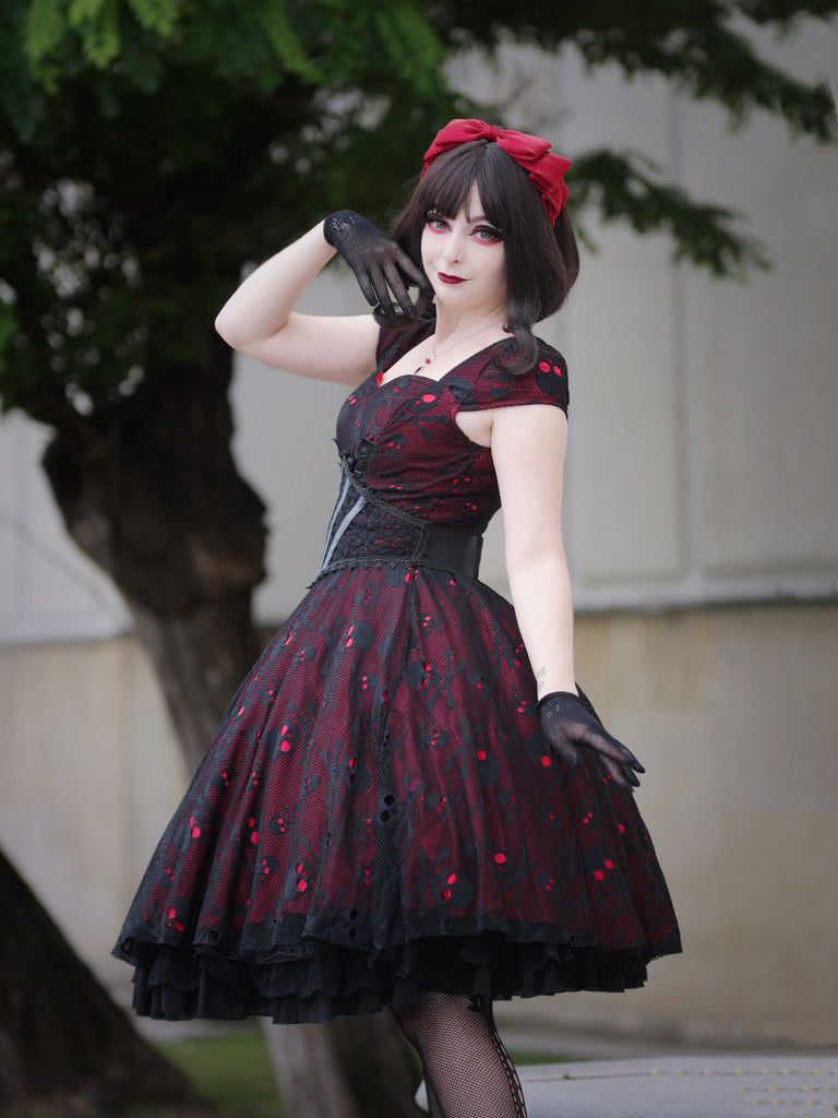 She slips into this Wine Red 1950s Skull Mesh Swing Dress and suddenly it's a 1950s daydream
