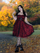 She slips into this Wine Red 1950s Skull Mesh Swing Dress and suddenly it's a 1950s daydream