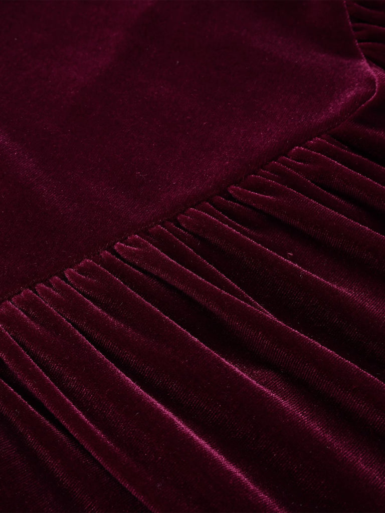 This Wine Red 1950s Spaghetti Strap Velvet Nightgown wraps her in 1950s elegance, one twirl at a time