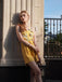 She finds her 1950s story in this Yellow 1950s Sunflower Halter Romper