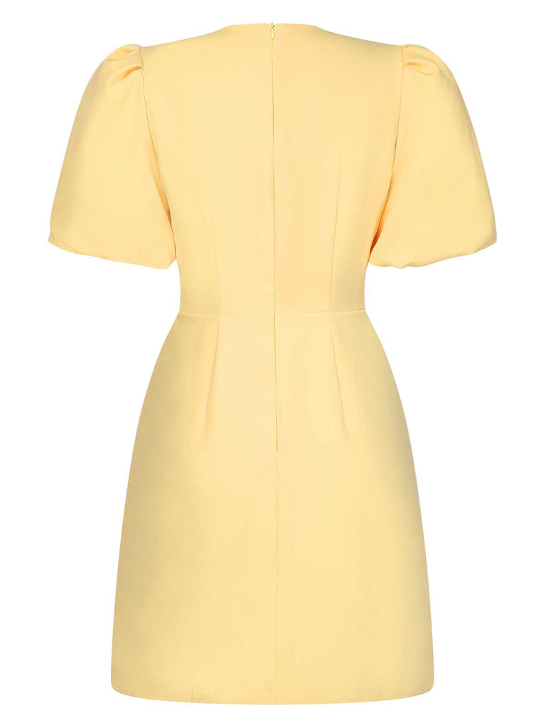This Yellow 1960s Bow Puff Sleeve Solid Dress wraps her in 1960s elegance, one twirl at a time