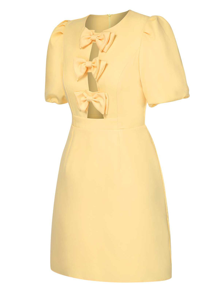 Yellow 1960s Bow Puff Sleeve Solid Dress — the kind of 1960s dress that makes strangers smile