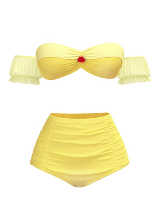 She's wearing Yellow 1970s Belle Princess Style Rose Puff Bikini Set and the whole beach remembers the 1970s