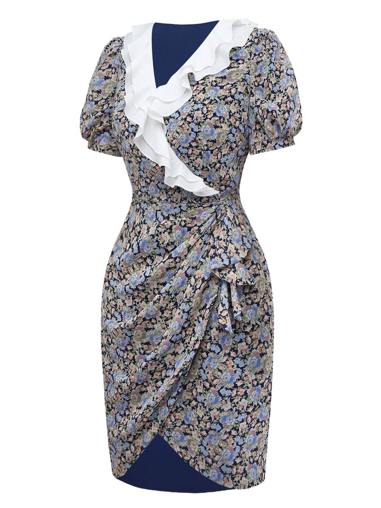 Angled studio shot of the navy floral dress showcasing the puff sleeve silhouette and tailored waist.