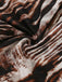 Macro view of the lightweight, silky fabric with a brown and black abstract animal stripe pattern.
