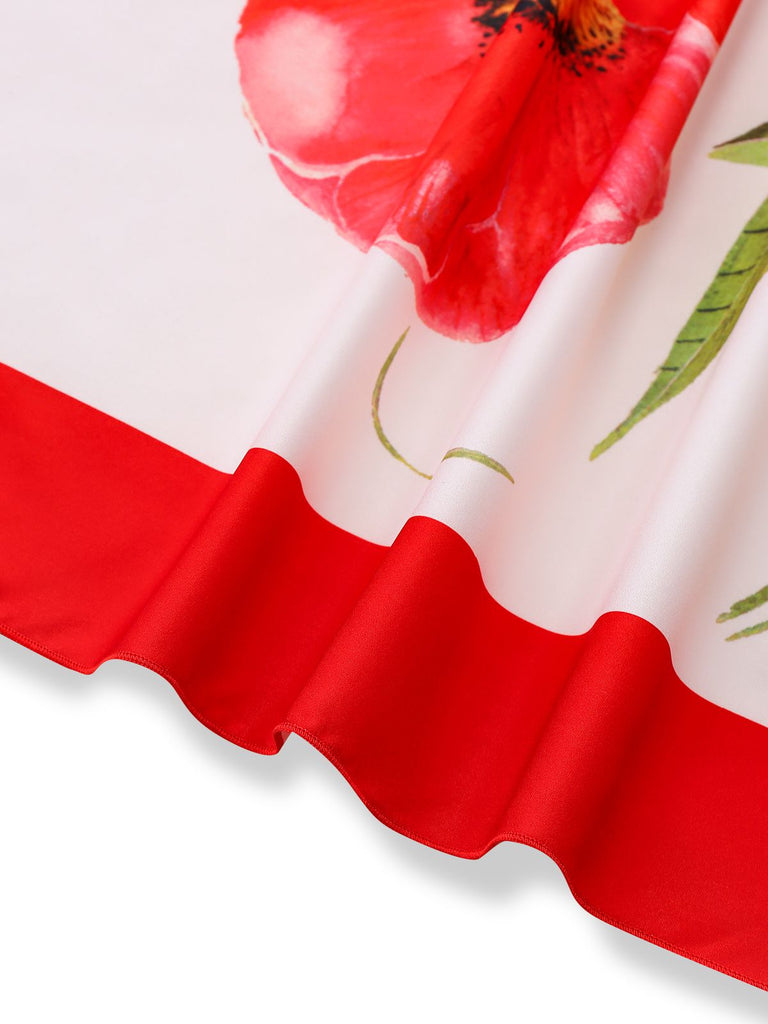 Detailed shot of the asymmetrical handkerchief hemline and clean edge stitching of the summer floral dress.