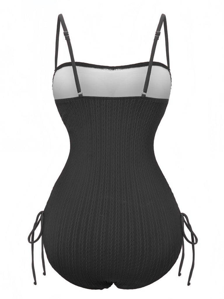 Black ribbed bodysuit with thin straps on a white background