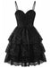 Angled view of the black version of the lace mini dress showcasing the volume of the tiered layers.
