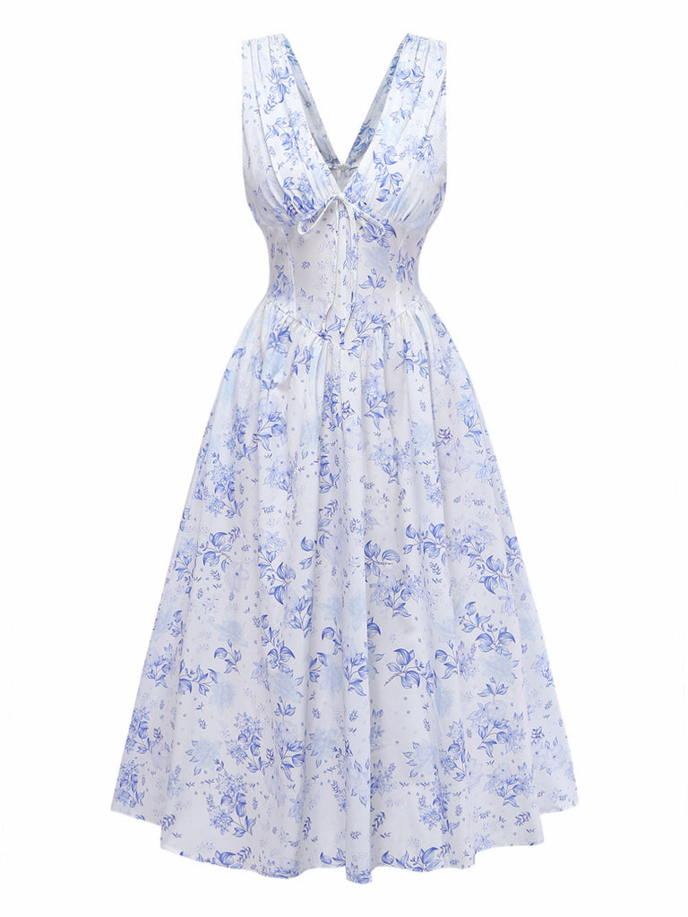 Retro 50s blue floral sleeveless corset dress featuring a plunging V-neckline, ideal for elegant garden parties.
