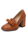 Brown leather shoe with a block heel on a white background