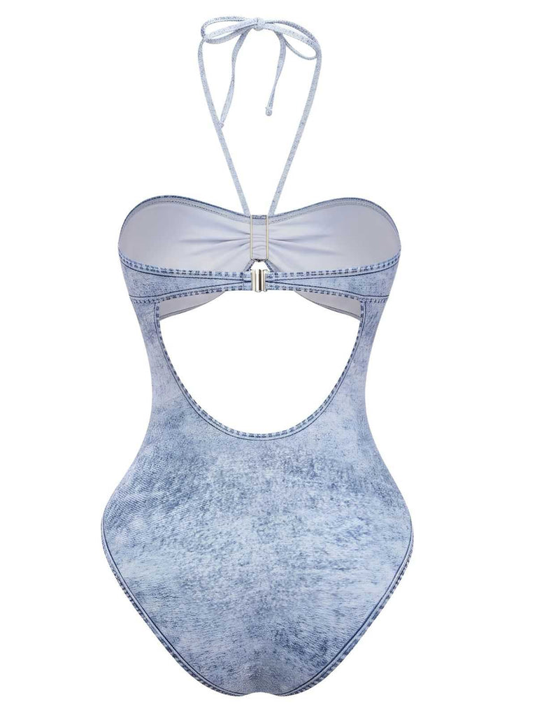 Rear view of the denim-print swimsuit showing the halter tie and the full-coverage back design.
