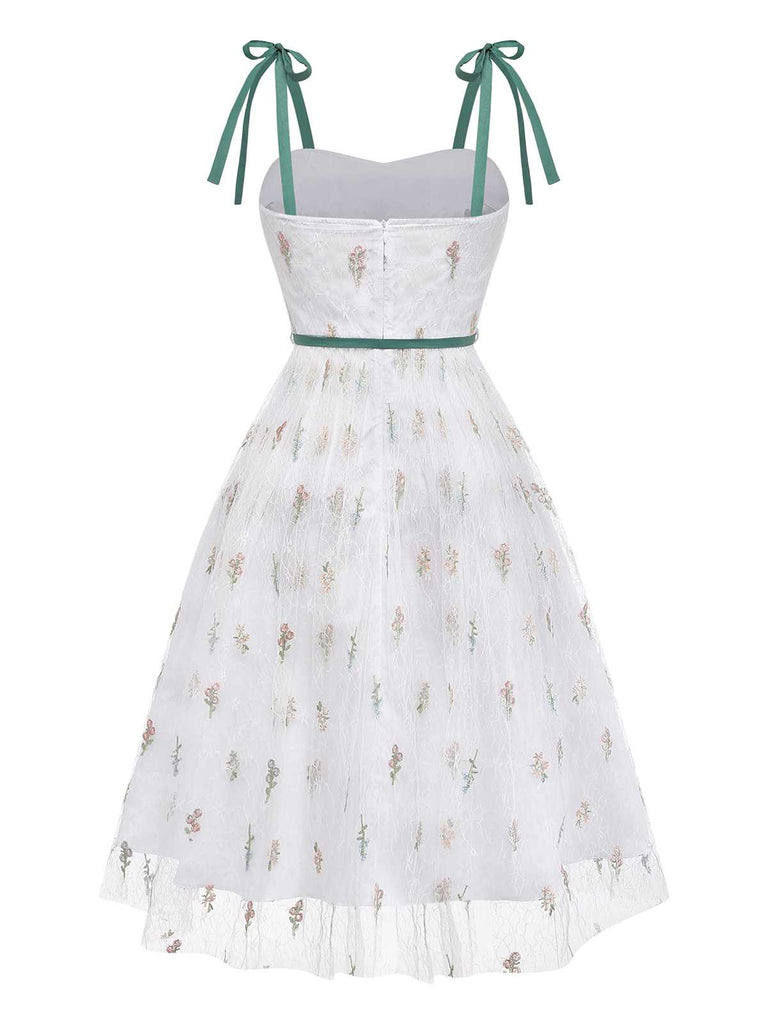 Rear view of the dress showing the velvet ribbon ties at the shoulders and the sheer mesh back.