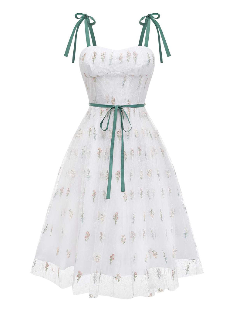 Front studio view of the white mesh dress highlighting the sweetheart neckline and tiered skirt.