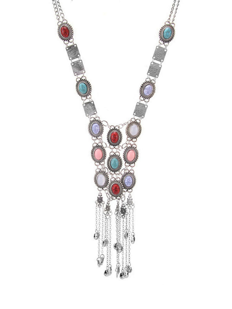 A clean front-facing shot of the silver ethnic-style necklace with dangling chain tassels and multicolor stones.