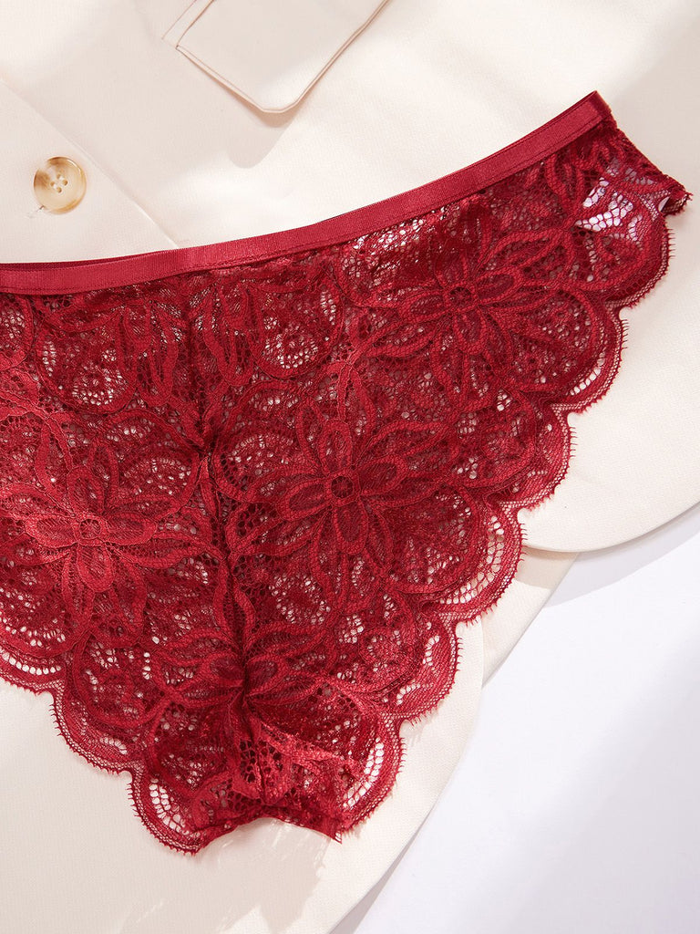 Detailed shot of the floral mesh lace and sheer fabric on the matching burgundy lingerie panties