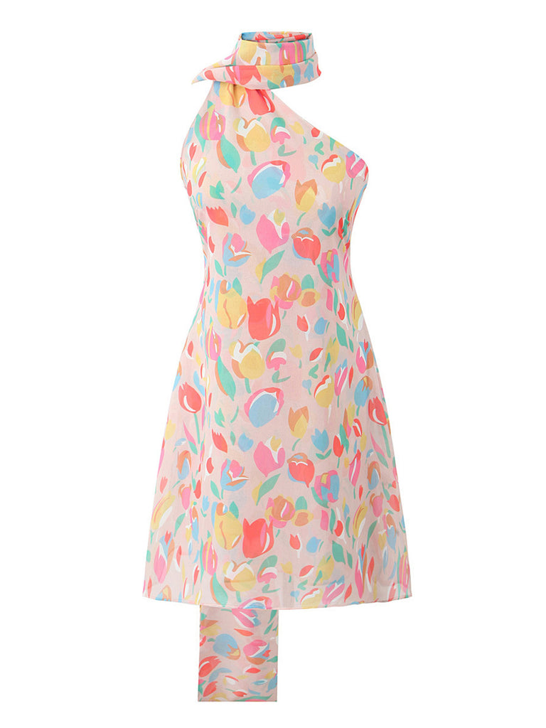 Front view of the colorful tulip print halter mini dress highlighting the asymmetric neckline and the long, flowing scarf-style neck tie.