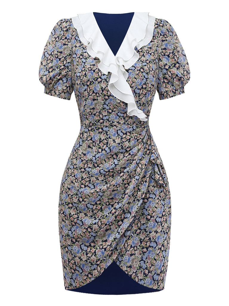 Front studio view of the floral mini dress highlighting the wrapped skirt detail and the decorative white ruffle along the neckline.