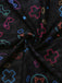 Macro view of the sheer mesh fabric featuring colorful neon outlines of game controllers and crosshair symbols.