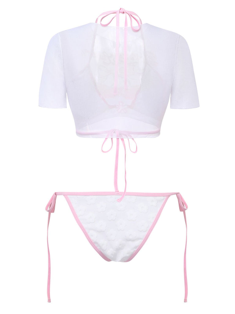 Rear view of the white swim set showing the open-back mesh design of the cropped top.