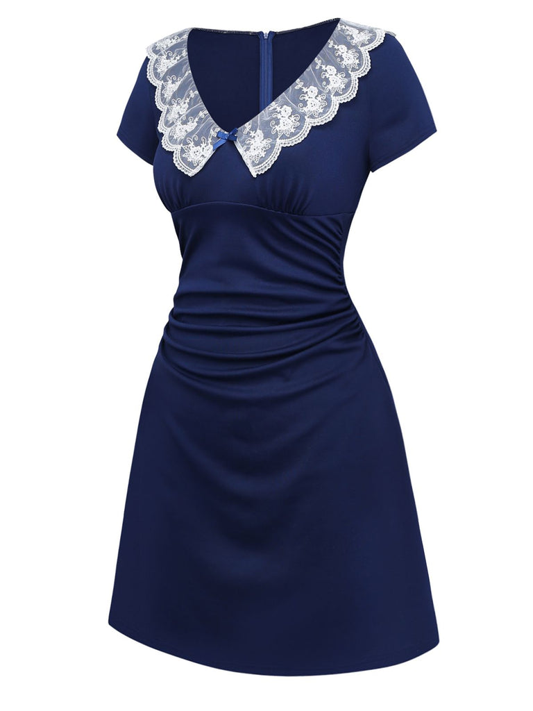 Side view of the retro dress highlighting the side ruching detail that creates a slim-fit silhouette.