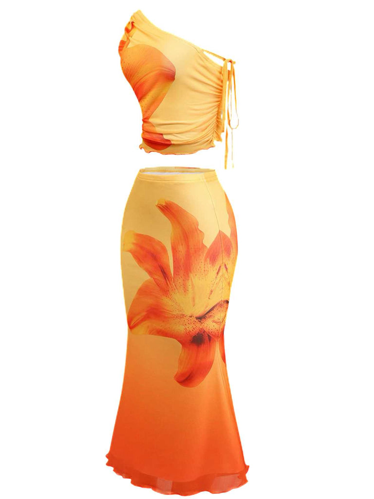 Side-angled view of the one-shoulder top and matching high-waisted skirt showcasing the form-fitting silhouette.