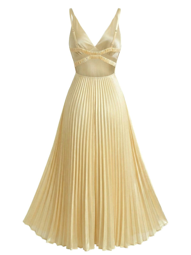 Back view of the pale gold midi dress showcasing the deep V-cut back and the continuous flow of the pleated skirt.