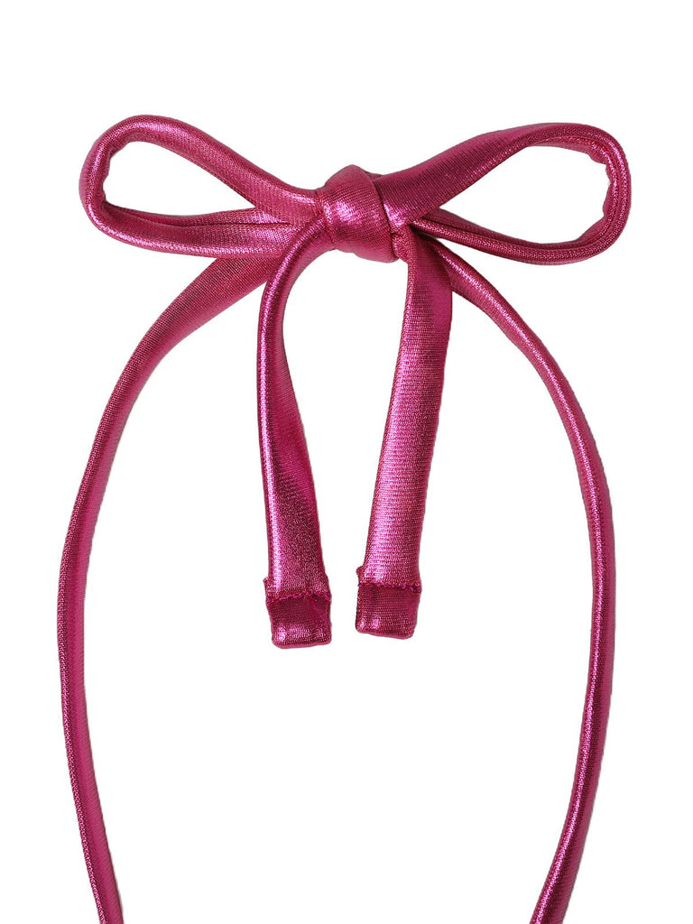 Pink ribbon bow on a white background