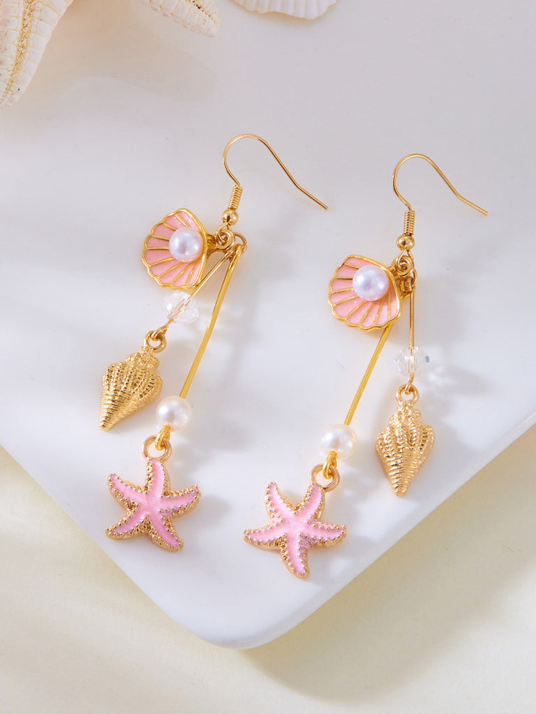 Pair of earrings with shell, starfish, and pearl designs on a white background