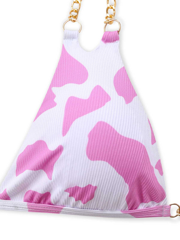 A flat lay view of the pink cow print halter bikini top.