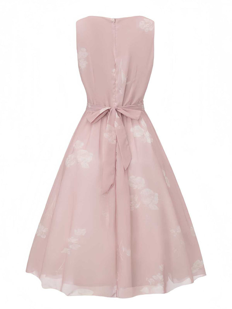 Back view of the dress showing a high back and a matching pink fabric tie at the waist.