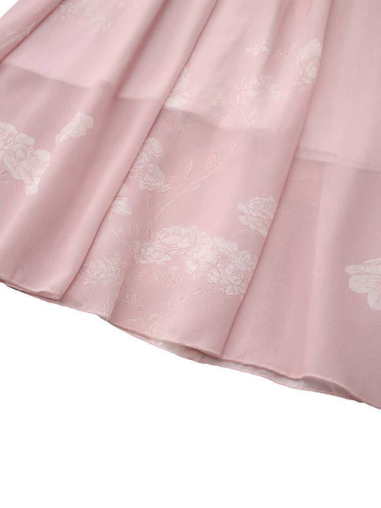 Detail shot of the bottom hem of the dress showing the layered floral pattern.