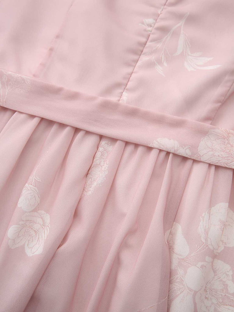Close-up of the gathered waistband and the subtle white floral motifs.
