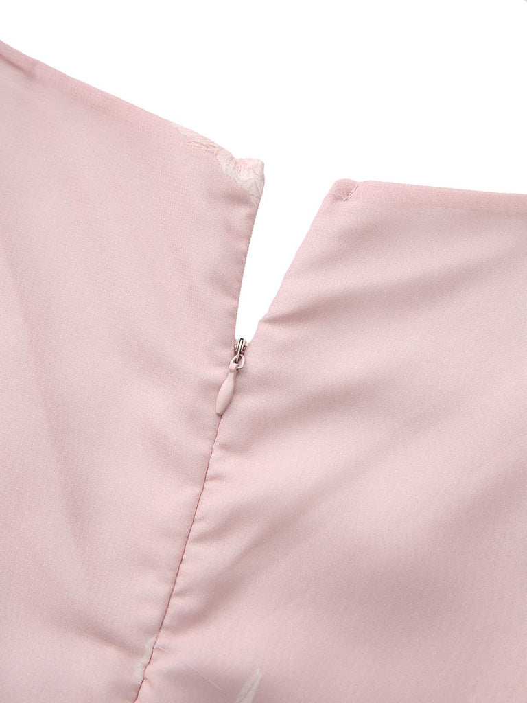 Close-up of the back zipper closure on the pink floral fabric.