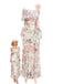 A cream-colored maxi dress featuring a romantic pink rose floral print, delicate spaghetti straps, and a ruffled neckline, shown with a retro fashion illustration.