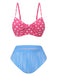 Front view of the mix-and-match bikini set showing the gathered pink polka dot top and the high-waisted blue striped swim bottoms.