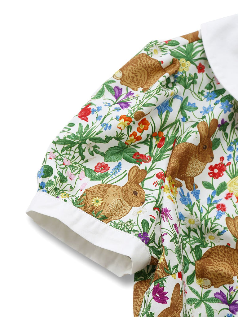 Detailed shot of the short puff sleeve with a contrasting white cuff on the bunny print fabric.