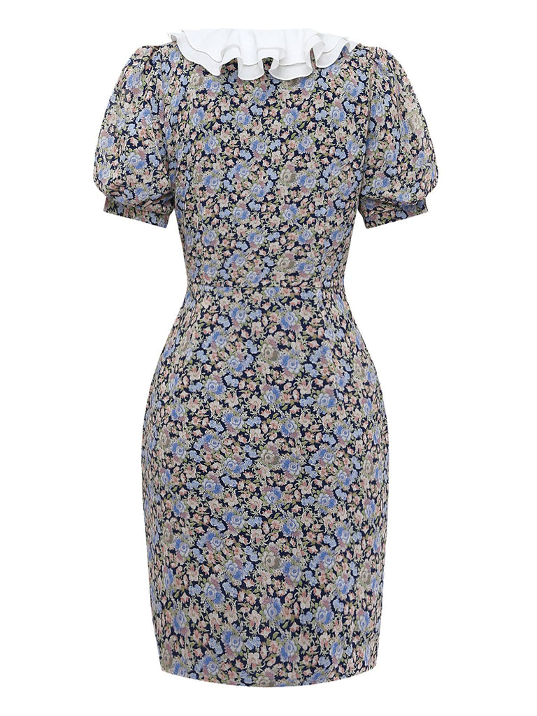 Rear view of the mini dress displaying the consistent floral pattern, high back, and puff sleeve detail.