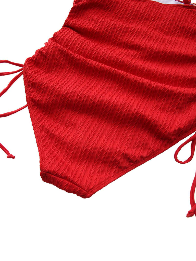 Red crumpled fabric with strings on a white background