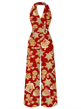 A red halter neck jumpsuit with a festive Christmas-themed pattern featuring gingerbread men, stars, and candy canes.