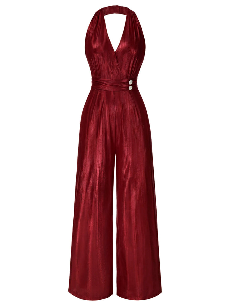 A full front view of a shimmering red satin 1970s style jumpsuit with a halter neck and wide-leg silhouette.