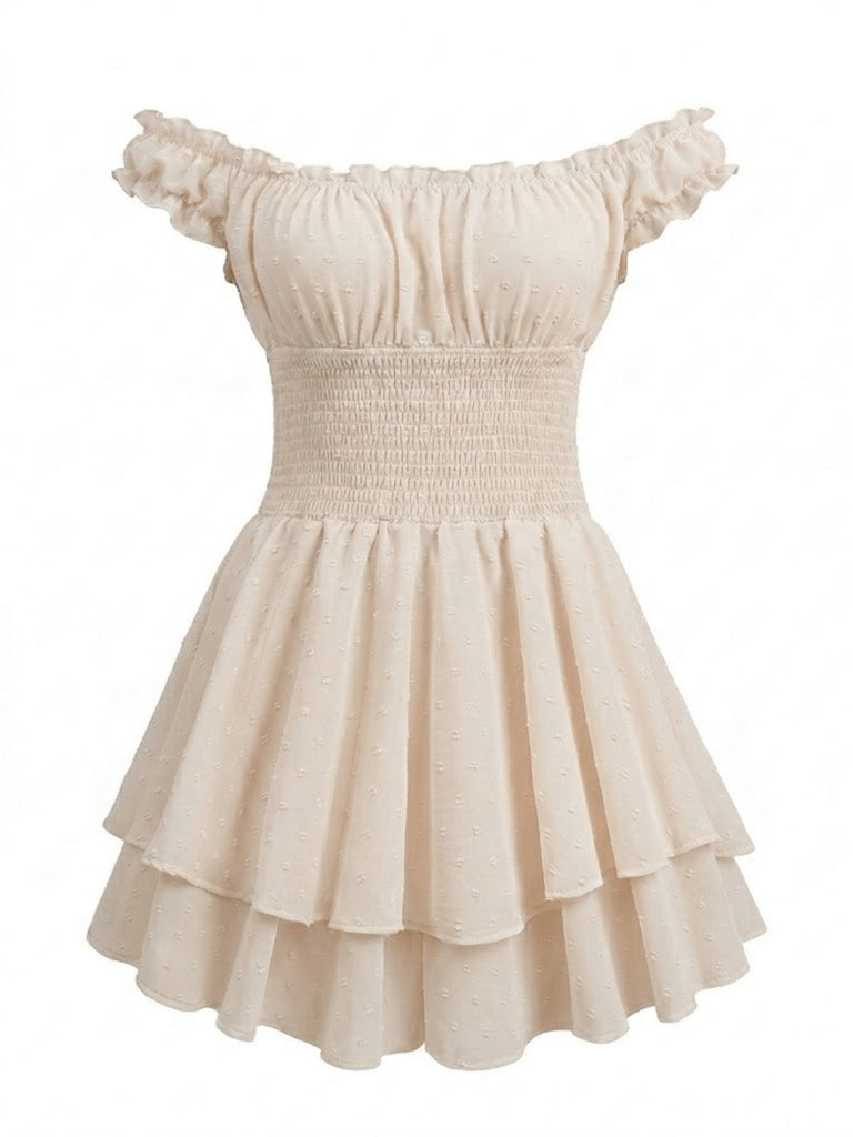 A front-facing shot of the cream mini dress showcasing the elastic smocked bodice and ruffled cap sleeves.