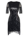 Front view of the black sequin cocktail dress with fringe detailing on the sleeves and skirt.