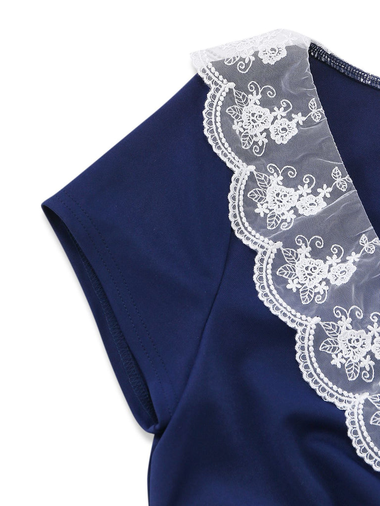 Detailed shot of the short sleeve construction and the high-quality stitching where the lace meets the navy fabric.