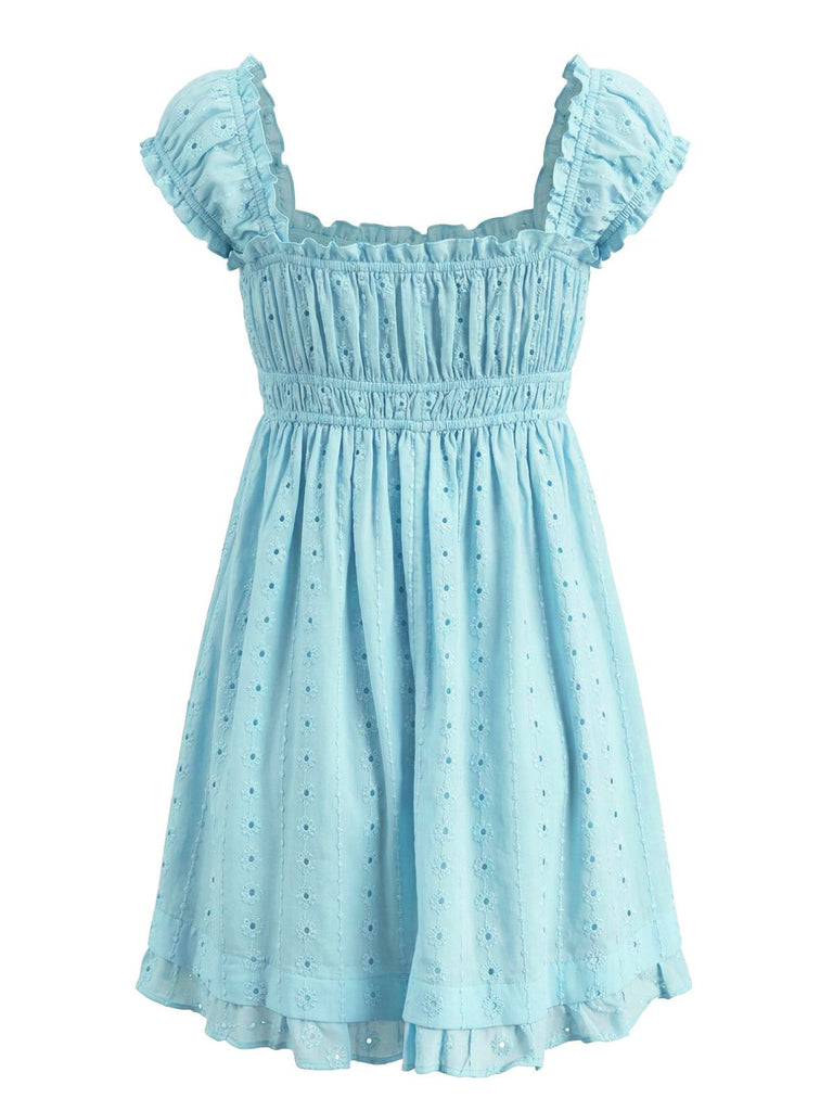 Back view of the sky blue mini dress highlighting the consistent smocking and eyelet pattern.