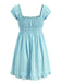Back view of the sky blue mini dress highlighting the consistent smocking and eyelet pattern.