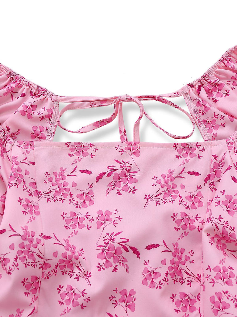 Close-up of the square neckline and delicate tie-back closure on the pink floral dress.