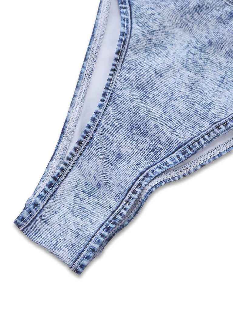 Close-up of the high-cut leg opening showing the interior white lining and the textured denim-patterned fabric.