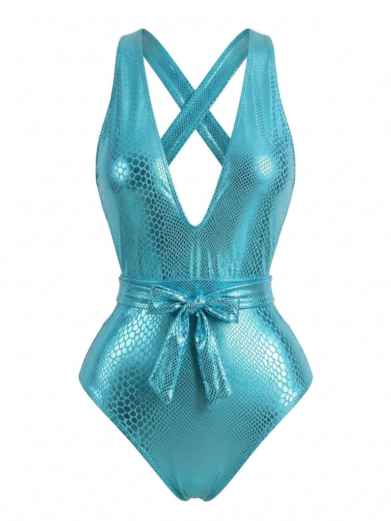 Studio front view of the shimmering teal swimsuit highlighting the belted waist and plunging neckline.