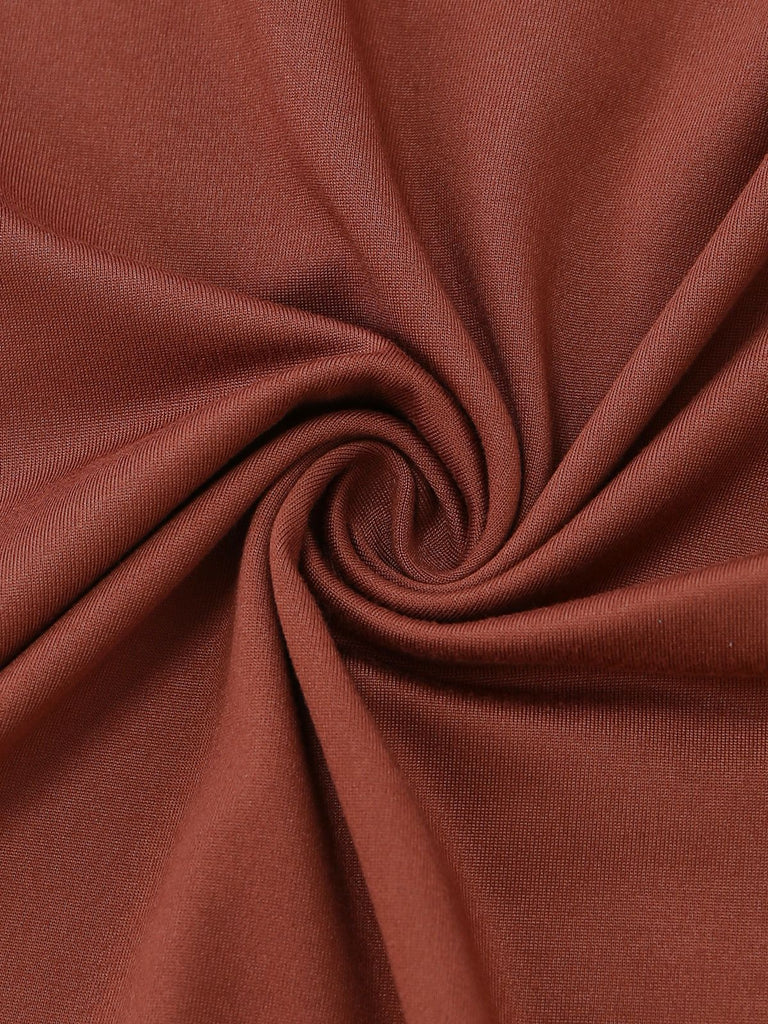 Macro view of the breathable, textured crepe fabric in a rich caramel hue.